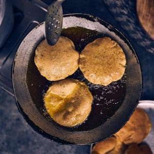 brown and black food on black pan